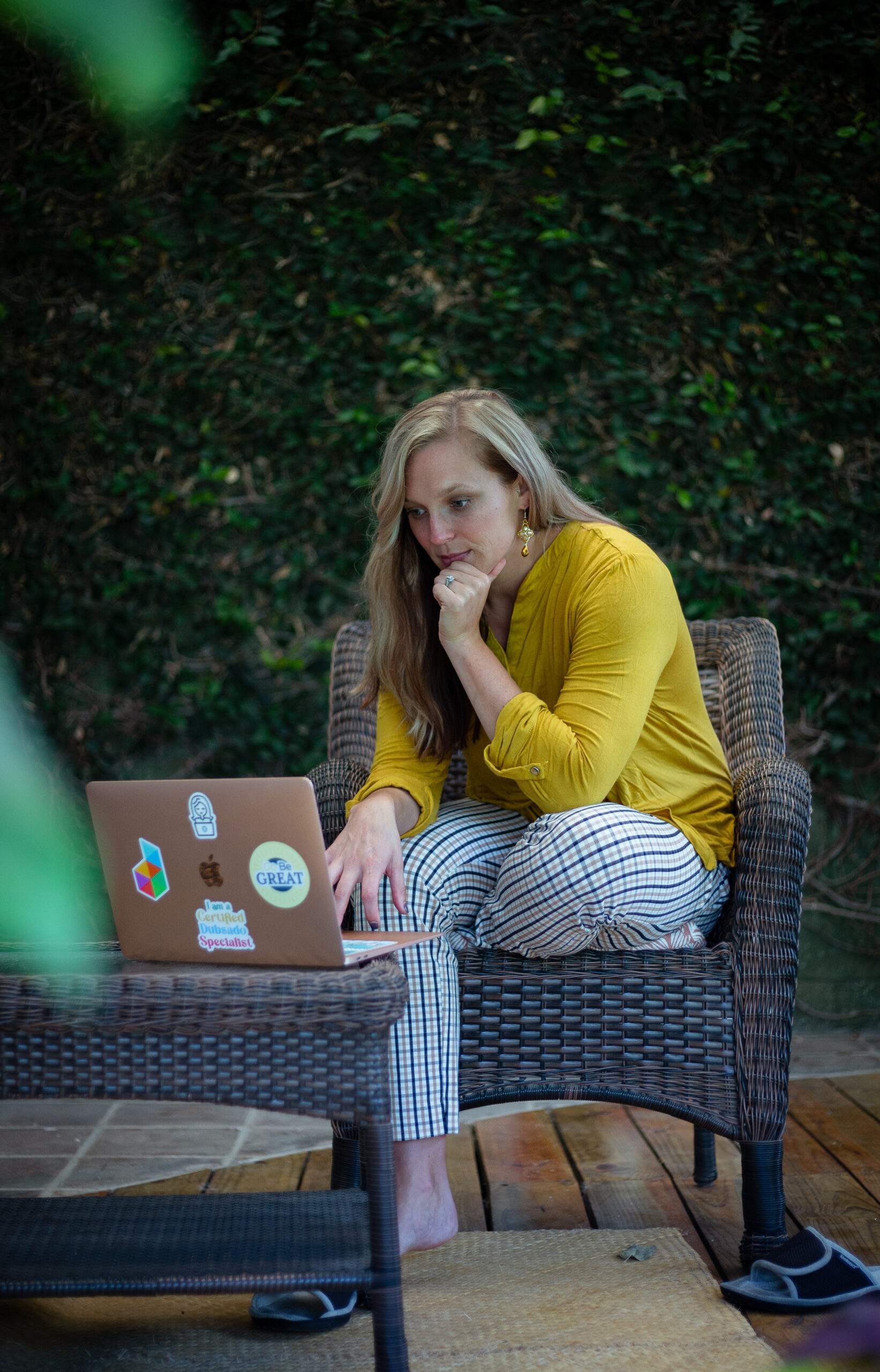 Ashley working at her laptop outdoors